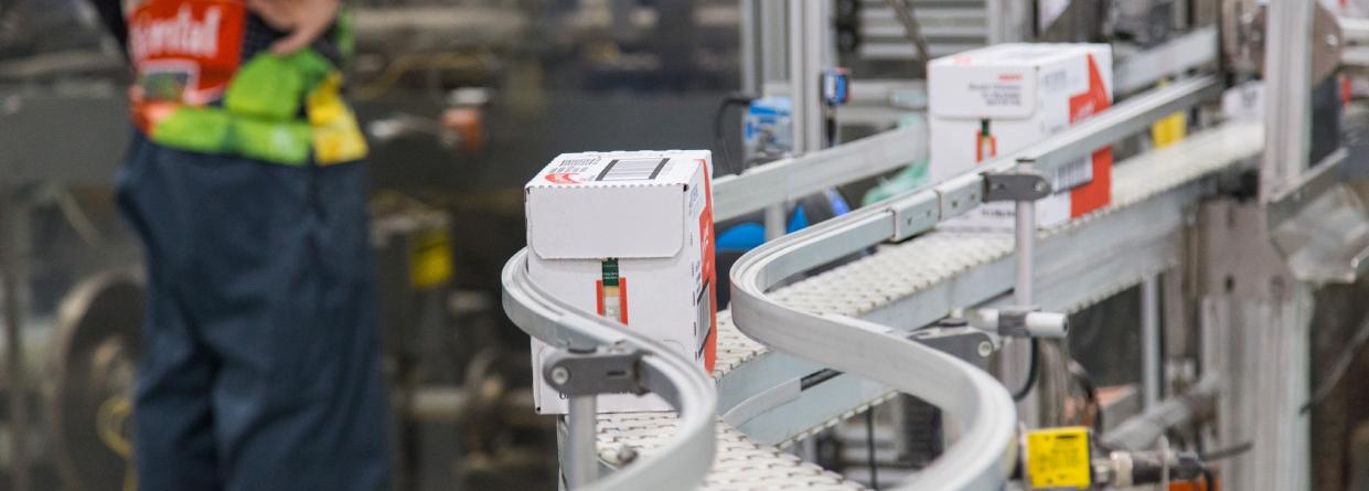 Photo of a conveyor belt in a packaging factory.