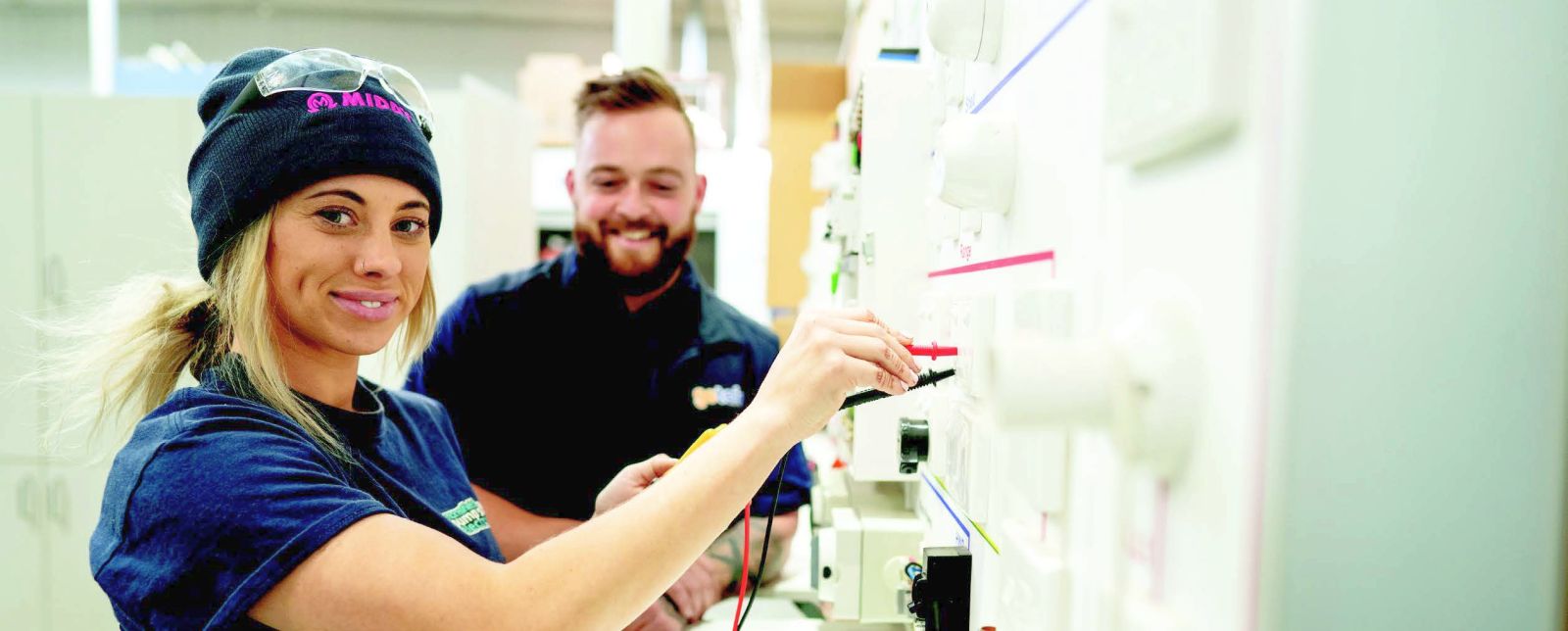 Female student studying to be an electrician.