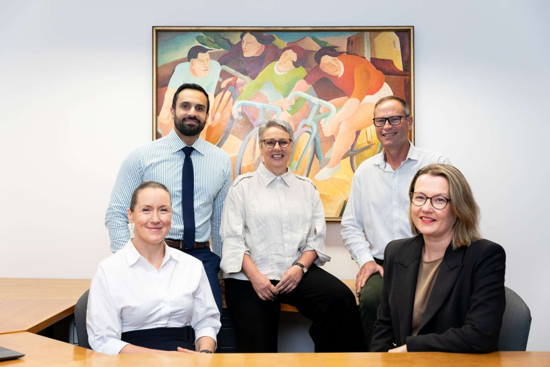 From left to right: Director Sustainable Development Geraldine Christou, Director Infrastructure Gary Randhawa, Chief Executive Officer Fiona Le Gassick, Director Corporate Services Chris Teitzel, and Director Community Louise Mitchell.
<br /><small>Artwork credit: Creagh Manning, <em>Sunday Cyclists</em>, 1976, oil on canvas. Shepparton Art Museum Collection, presented by the Visual Arts Board Contemporary Art Collection, 1984.
асс. по. 1984.0006</small>