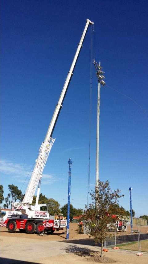 Light pole being installed. 