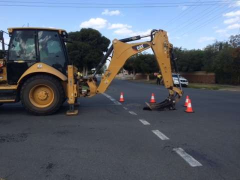 A back hoe is dealing with a hole which appeared on Orr Street this afternoon. 