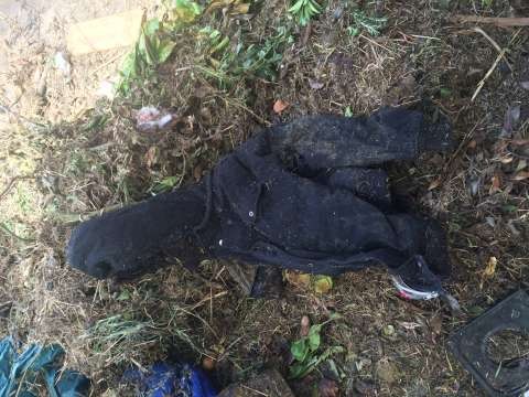 The waste contamination of a clothing jacket from organic green kerbside collection trucks taken at Western Composting. 