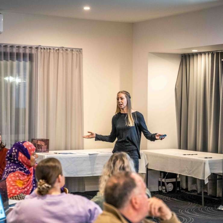 A presenter addressing attendees
