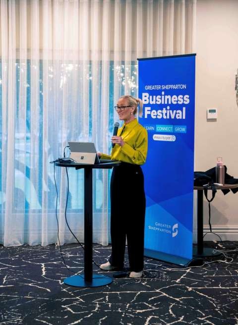A presenter addressing attendees