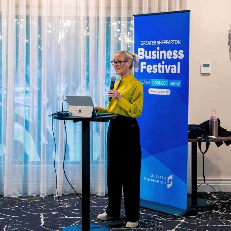 A presenter addressing attendees